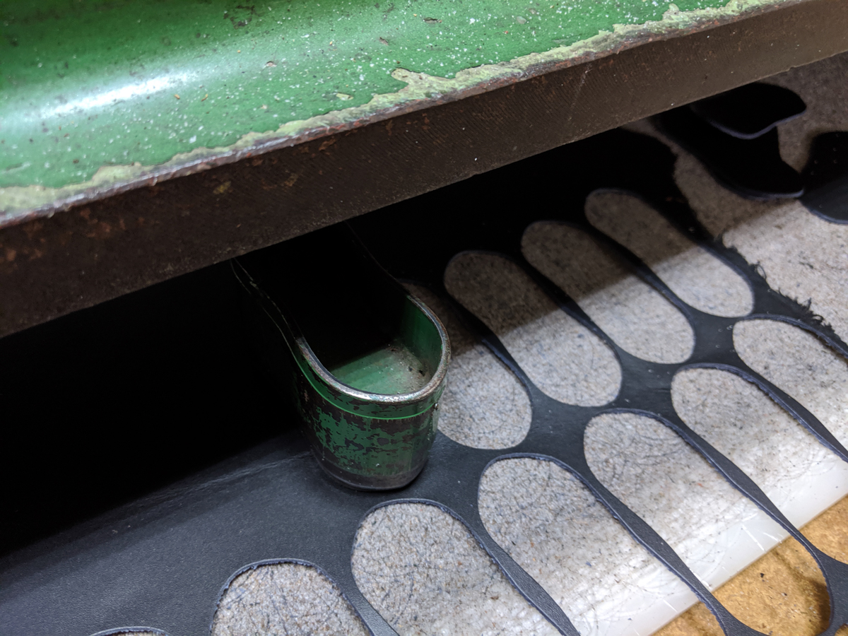 Die-cutting leather at Isson Webbing factory in Taoyuan, Taiwan